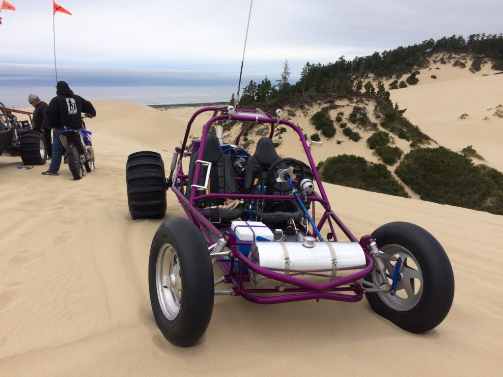 purple sand buggy on dune